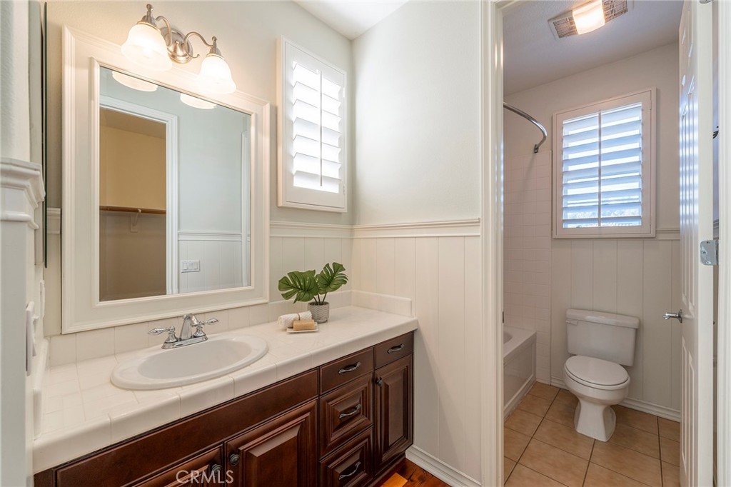 6 Shepherd Court Ladera Ranch, CA 92694 - Photo 32 of 68 a bathroom with a sink a toilet and a mirror