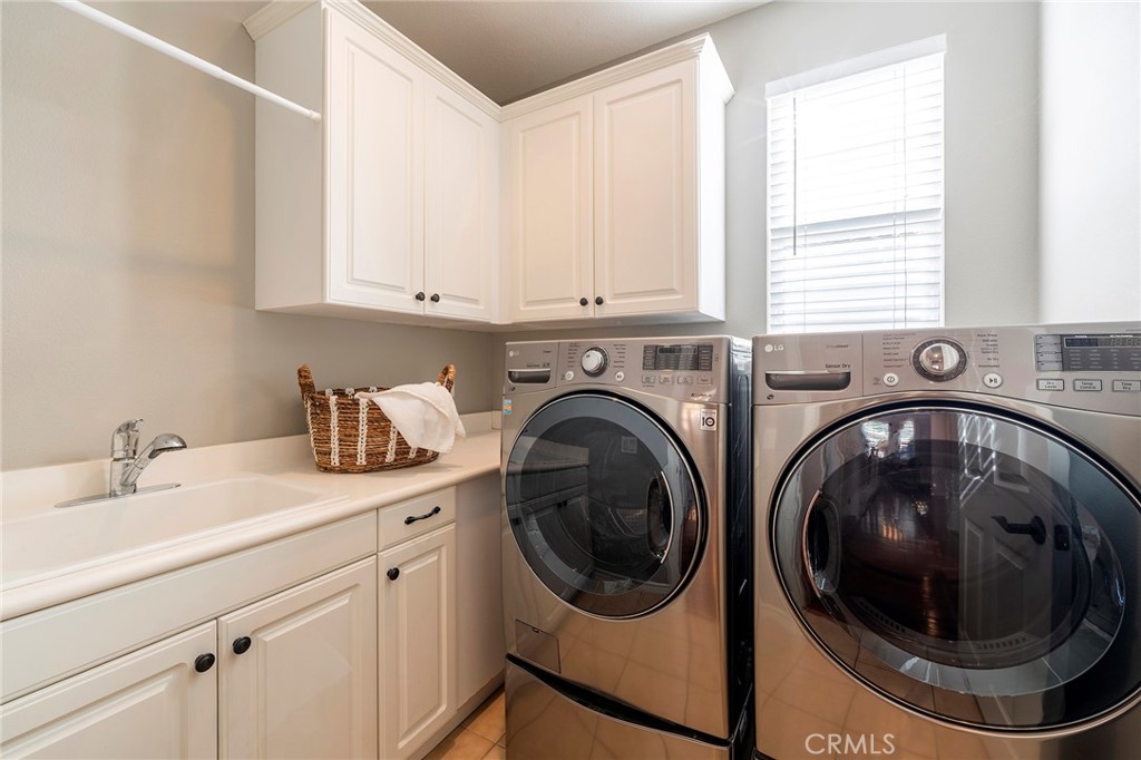 6 Shepherd Court Ladera Ranch, CA 92694 - Photo 41 of 68 a utility room with sink dryer and washer
