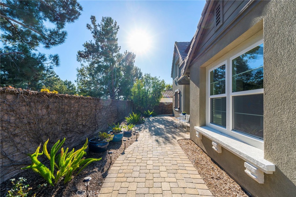 6 Shepherd Court Ladera Ranch, CA 92694 - Photo 50 of 68 a view of a chairs with flower in front of a house