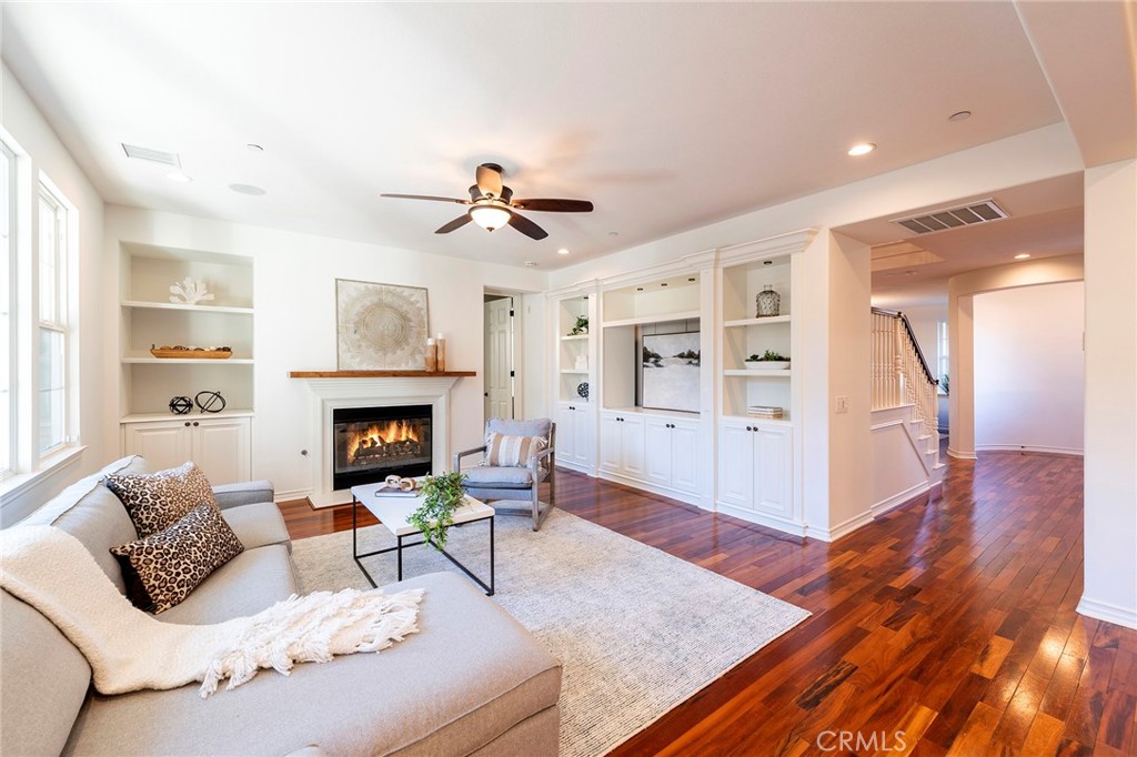 6 Shepherd Court Ladera Ranch, CA 92694 - Photo 9 of 68 a living room with furniture and a fireplace