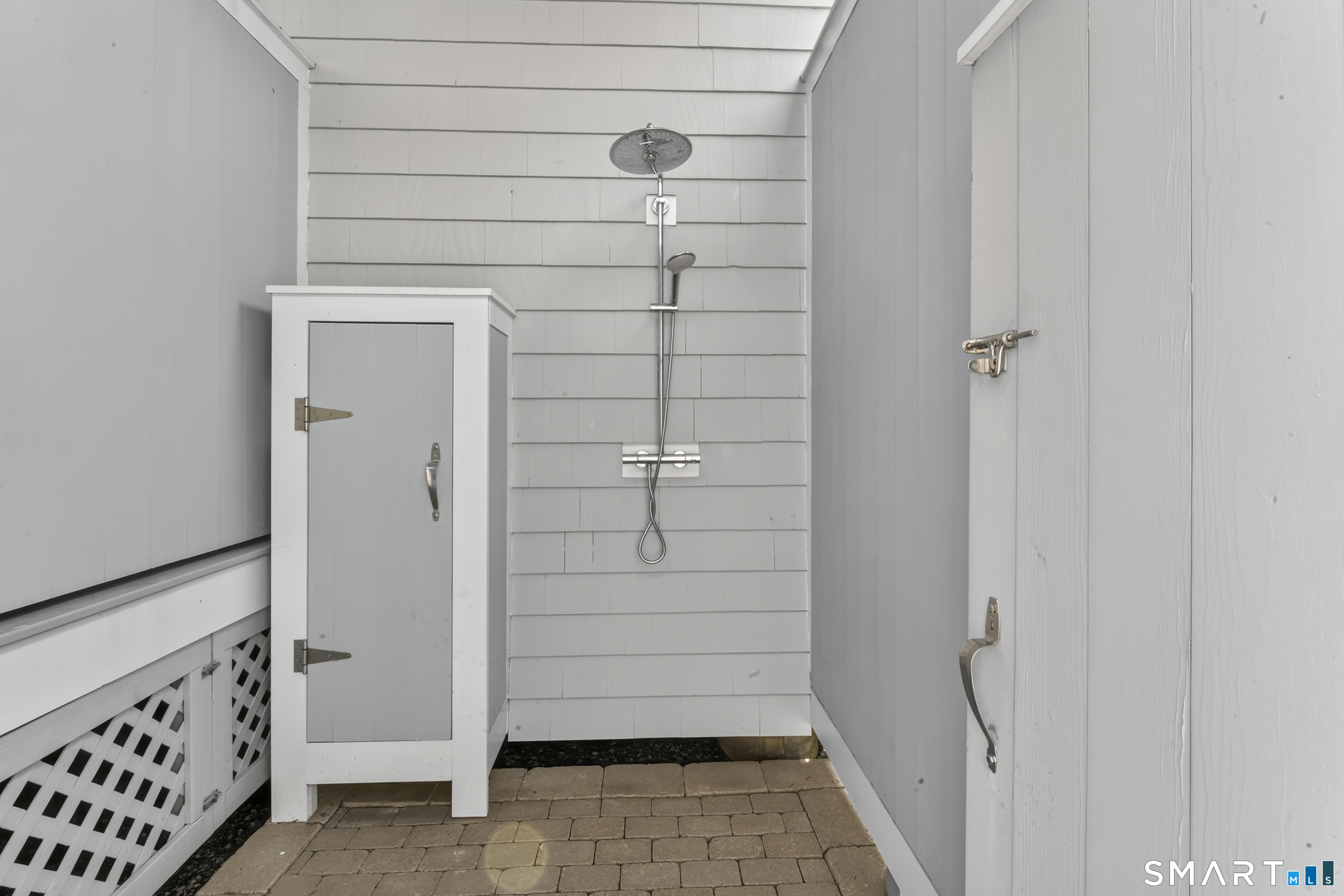 679 Fairfield Beach Road, Unit 679 Fairfield, CT 06824 - Photo 35 of 38 Private outdoor shower with hot/cold water.