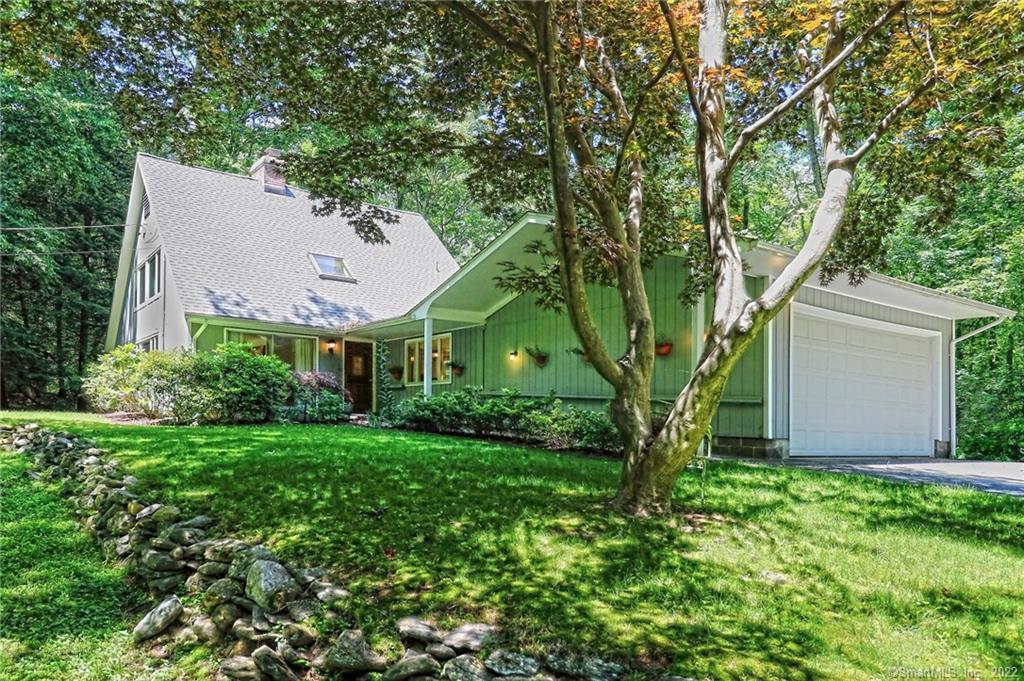 77 Orchard Road Woodbridge, CT 06525 - Photo 1 of 1 front view of a house with a tree