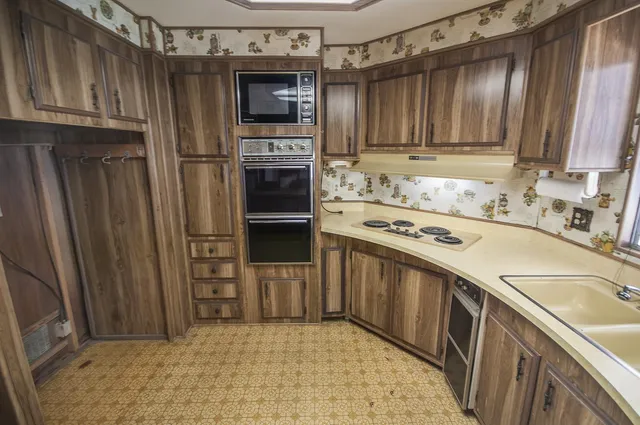 a bathroom with a shower and a sink