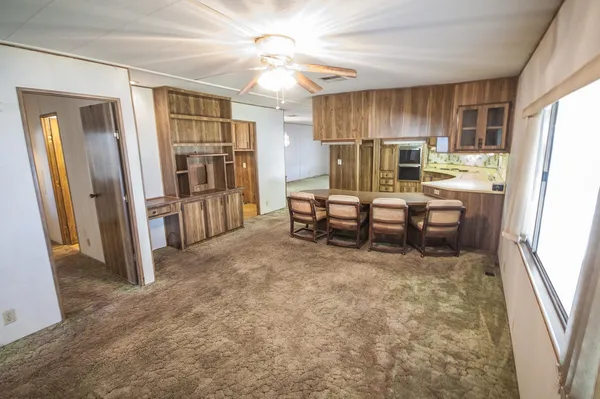 a kitchen with a stove a sink and a refrigerator