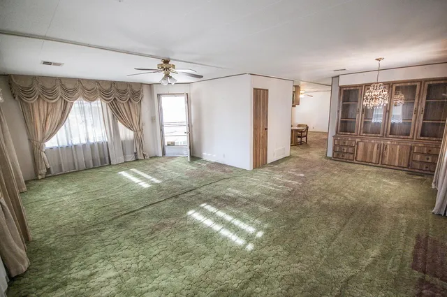 a view of a room with a windows and a table