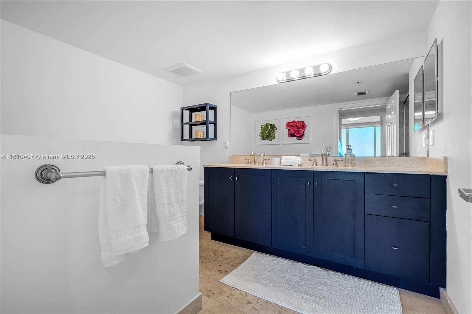 3232 Southwest 22nd Terrace, Unit 1106 Miami, FL 33145 - Photo 11 of 22 a view of hallway with cabinet and mirror