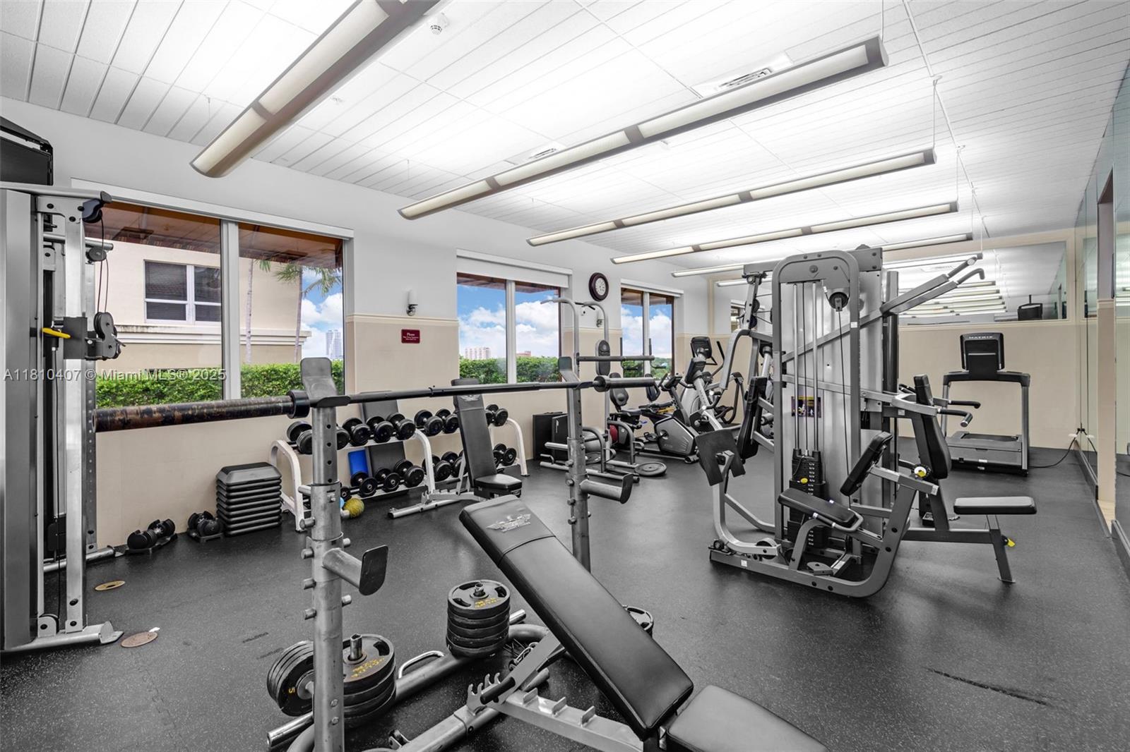 3232 Southwest 22nd Terrace, Unit 1106 Miami, FL 33145 - Photo 19 of 22 a view of a room with gym equipment