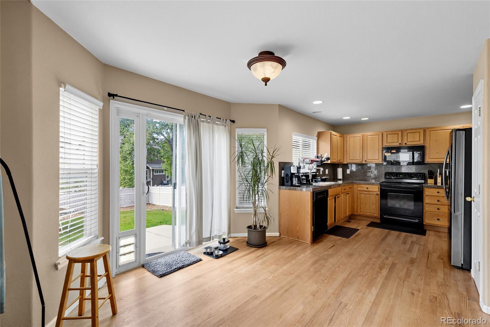 10245 Dusk Street Firestone, CO 80504 - Photo 11 of 24 a kitchen with sink refrigerator and stove