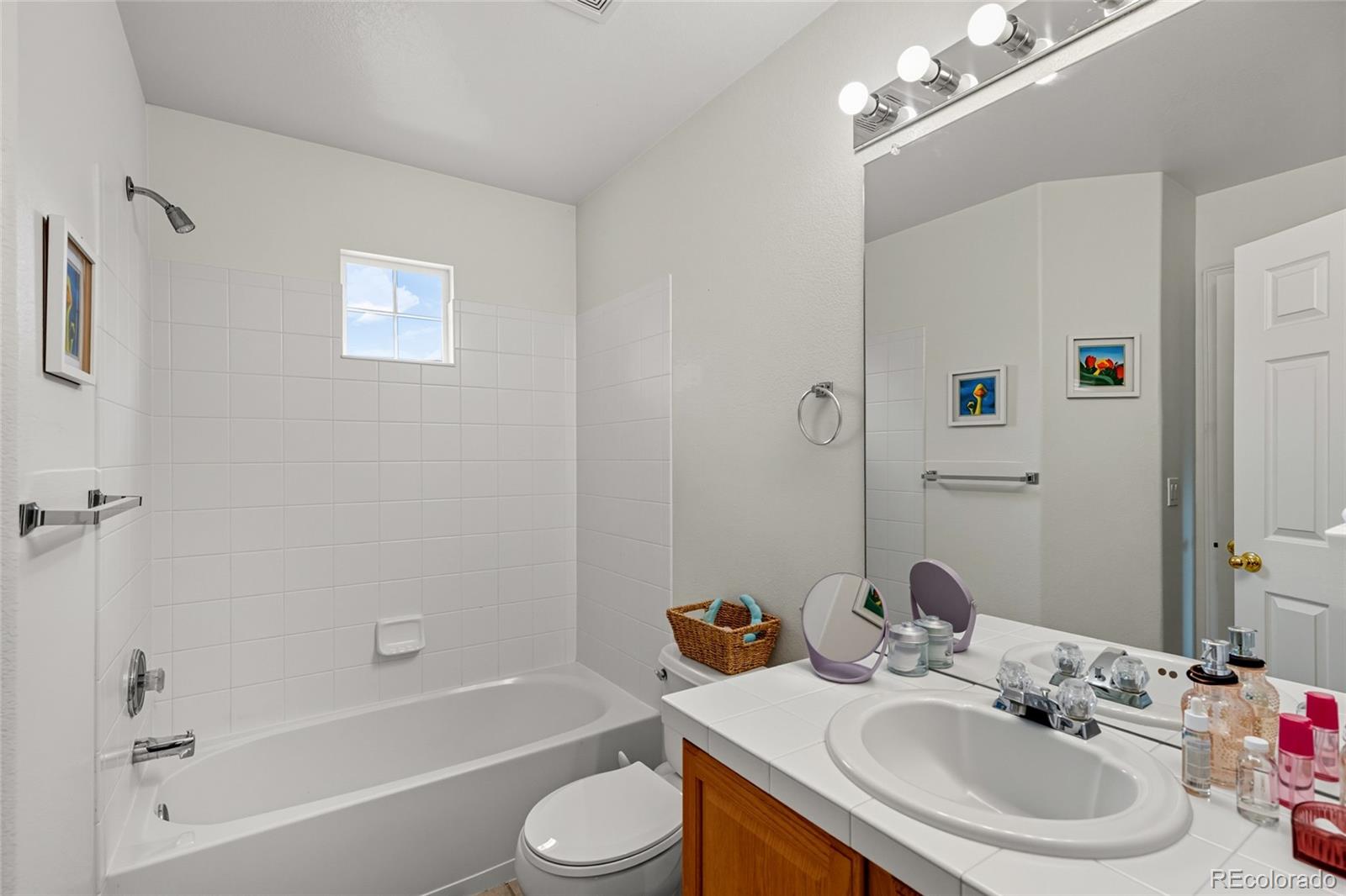 10245 Dusk Street Firestone, CO 80504 - Photo 18 of 24 a bathroom with a sink toilet and shower