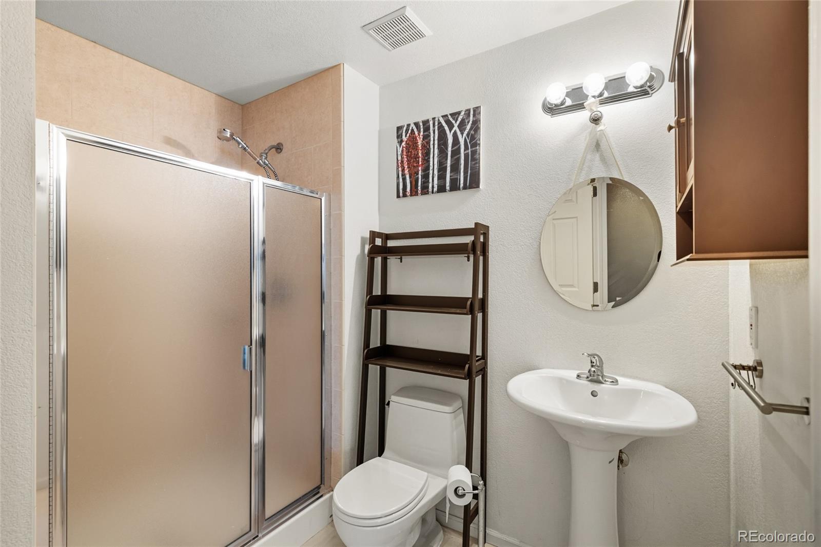 10245 Dusk Street Firestone, CO 80504 - Photo 21 of 24 a bathroom with a sink toilet and shower