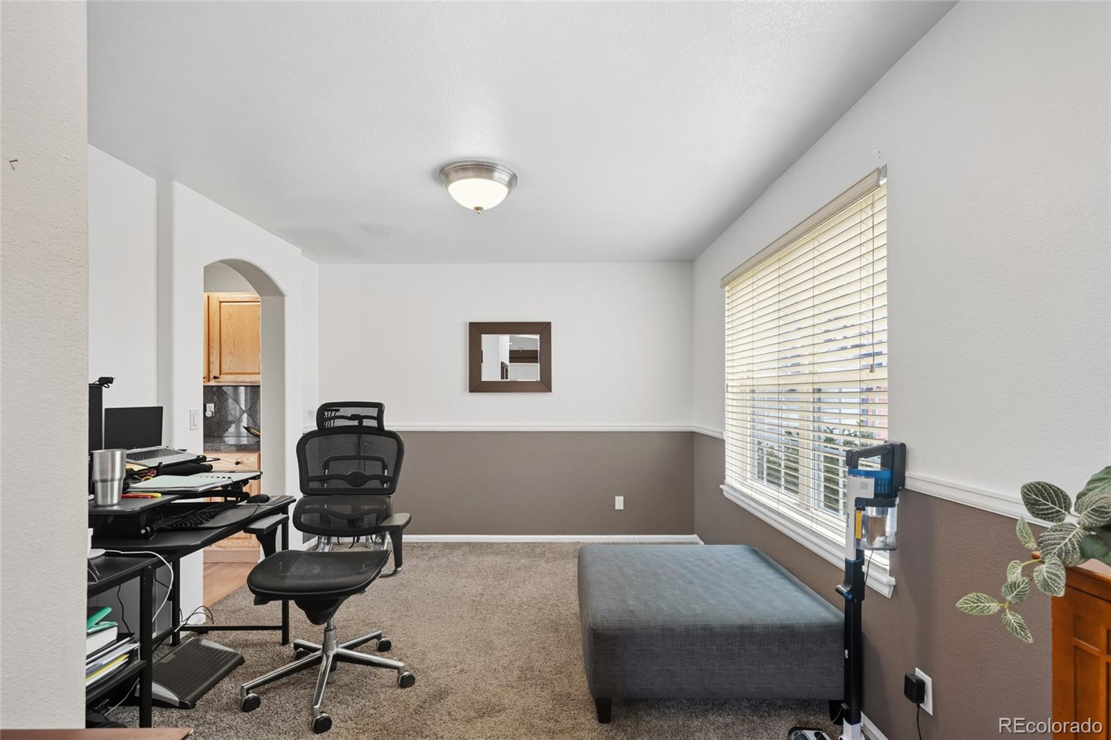 10245 Dusk Street Firestone, CO 80504 - Photo 5 of 24 a workspace with furniture and a window