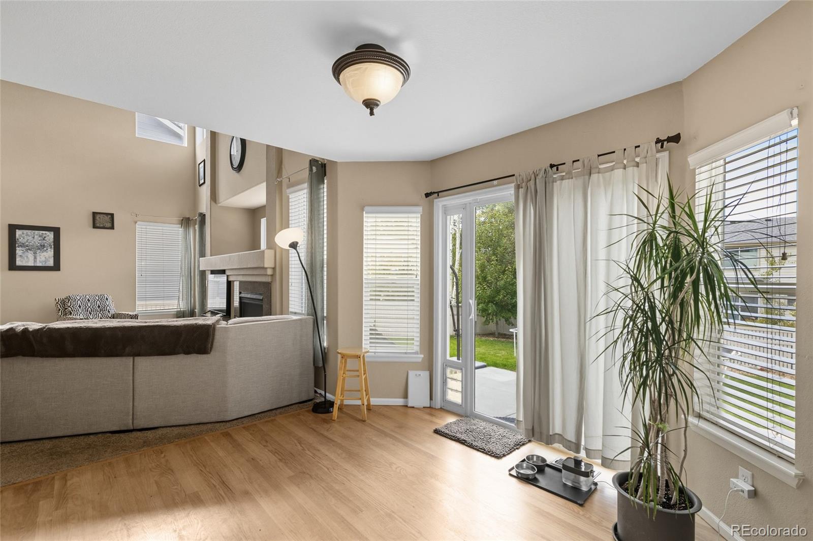 10245 Dusk Street Firestone, CO 80504 - Photo 8 of 24 a living room with furniture and a large window