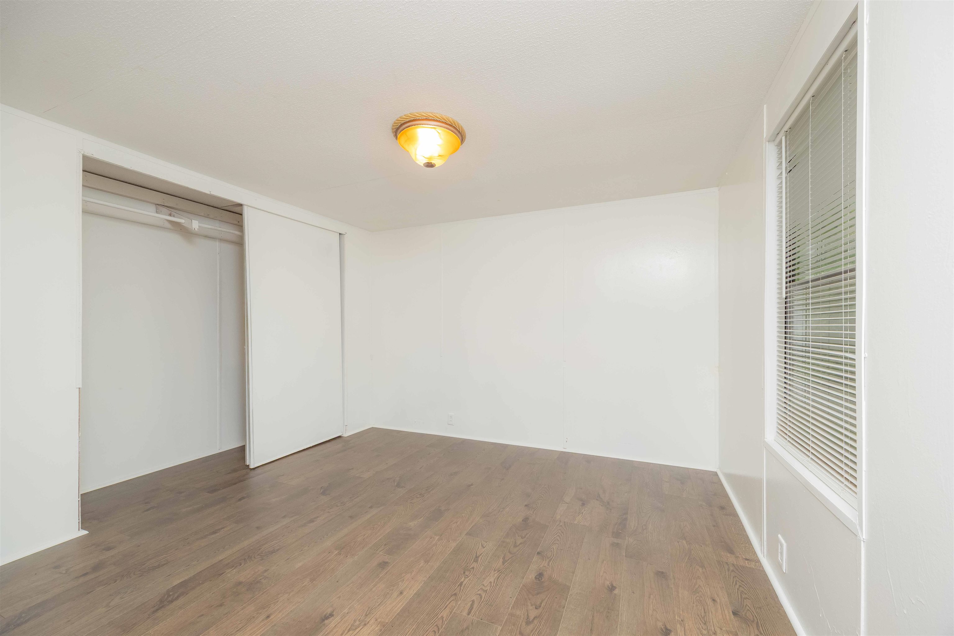 7553 U.S. Rte 1 St. Augustine, FL 32086 - Photo 15 of 16 a view of an empty room with wooden floor and a window