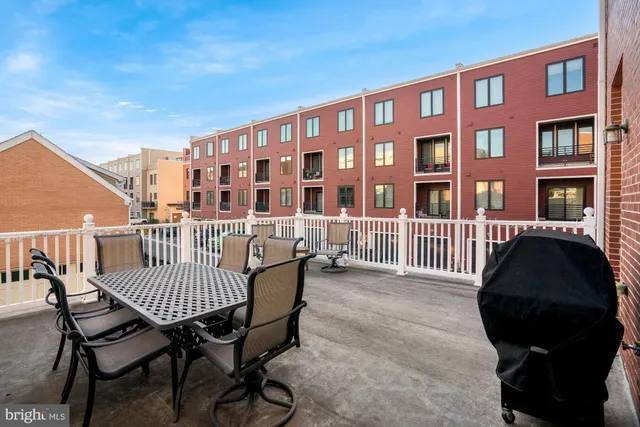 a view of a chair and table in the balcony