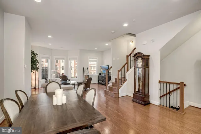 a living room with furniture gym equipment and view of living room