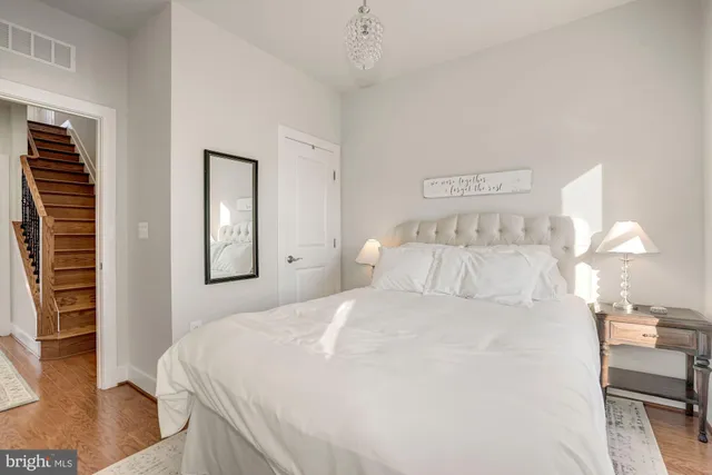 a bedroom with a bed and a couch