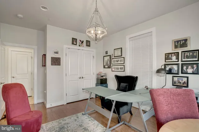 a living room with furniture a rug and a window