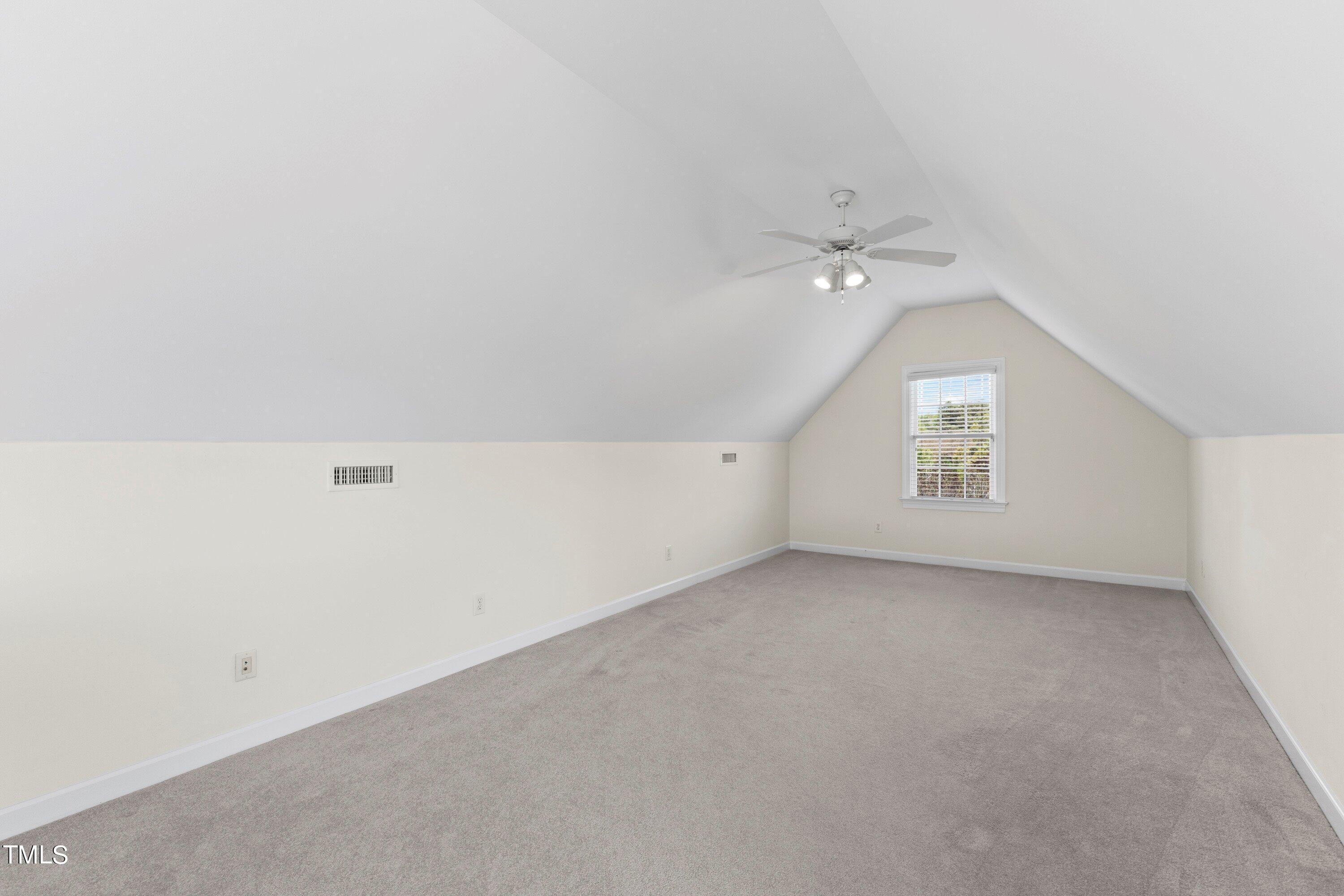 1004 Pasture View Lane Raleigh, NC 27603 - Photo 36 of 48 The other side of the bonus room could be a TV room or a playroom.