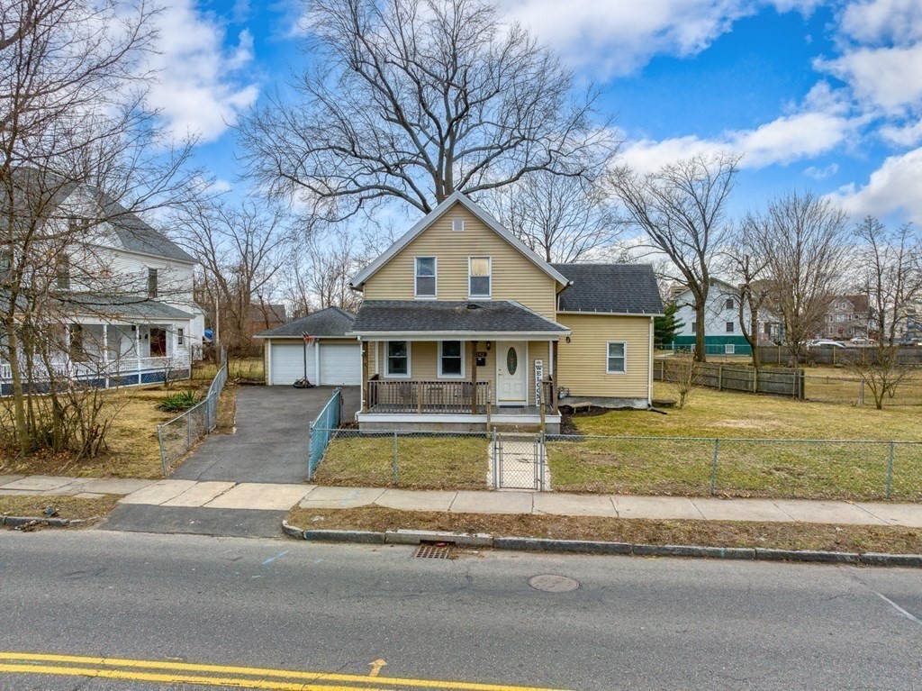 192 Allen Street Springfield, MA 01108 - Photo 1 of 35 a front view of a house with a yard