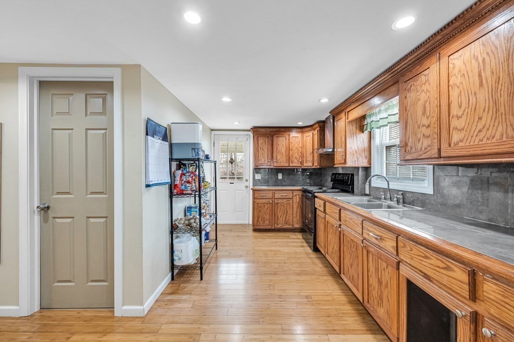 192 Allen Street Springfield, MA 01108 - Photo 12 of 35 a kitchen with stainless steel appliances granite countertop a refrigerator and a sink