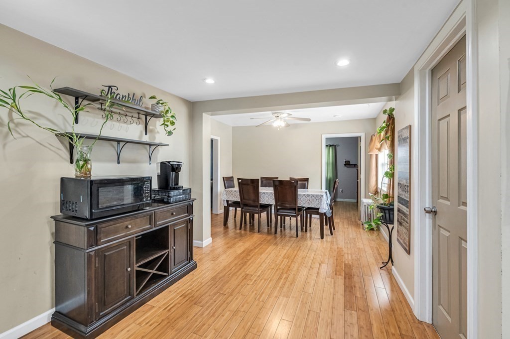192 Allen Street Springfield, MA 01108 - Photo 13 of 35 a view of a kitchen with furniture and wooden floor