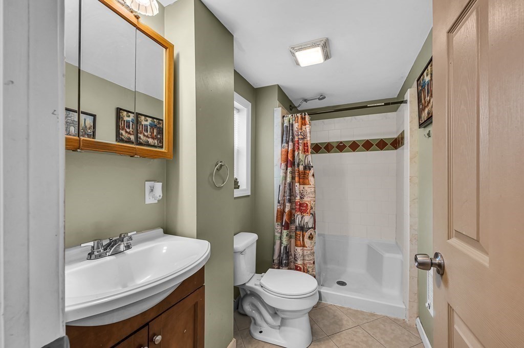 192 Allen Street Springfield, MA 01108 - Photo 14 of 35 a bathroom with a sink toilet and shower