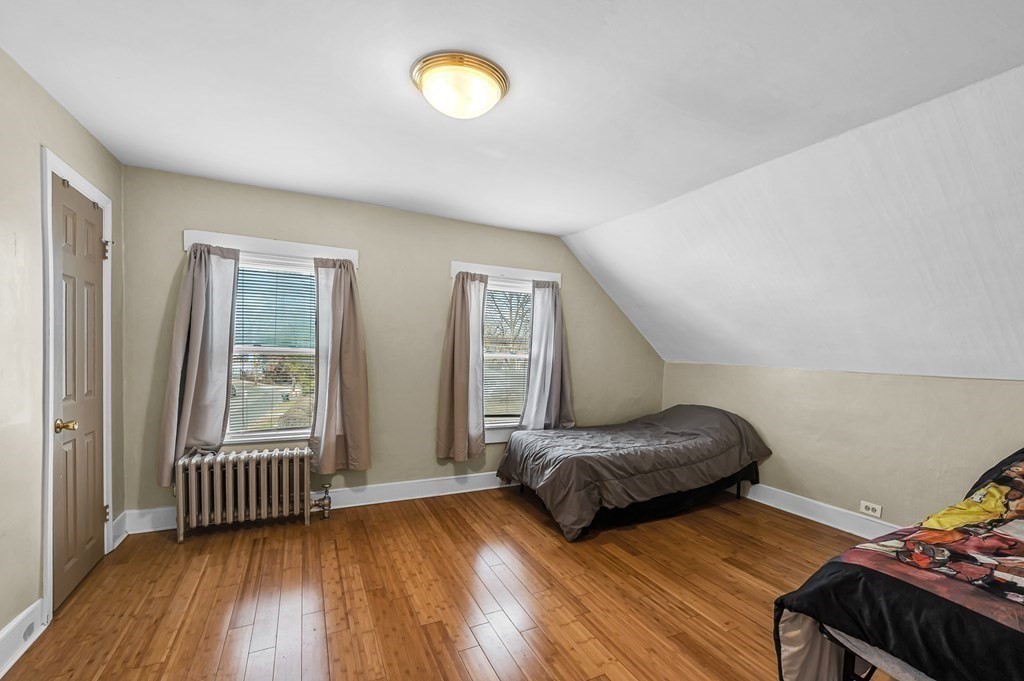 192 Allen Street Springfield, MA 01108 - Photo 19 of 35 a bedroom with furniture and a window