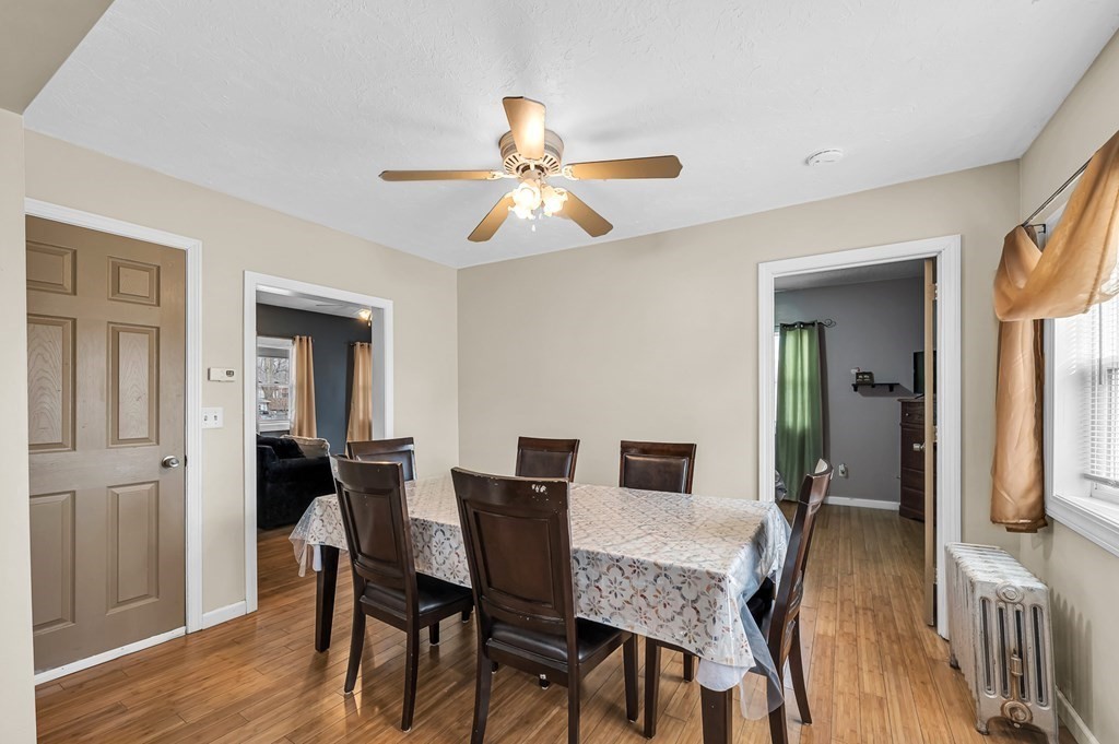 192 Allen Street Springfield, MA 01108 - Photo 8 of 35 a view of a dining room with furniture and wooden floor