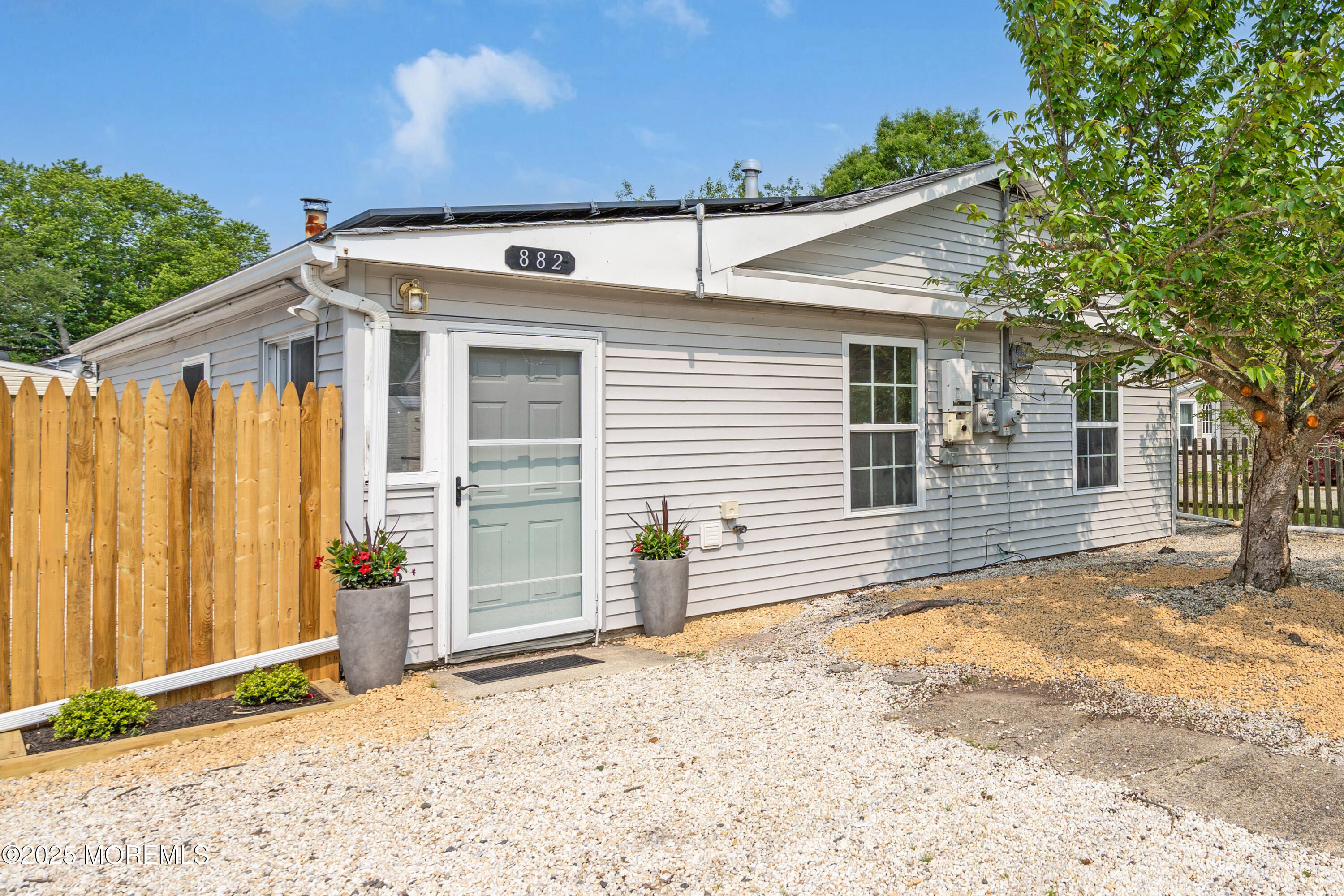 882 Radio Road Little Egg Harbor, NJ 08087 - Photo 1 of 24 a view of a house with a backyard and a garage