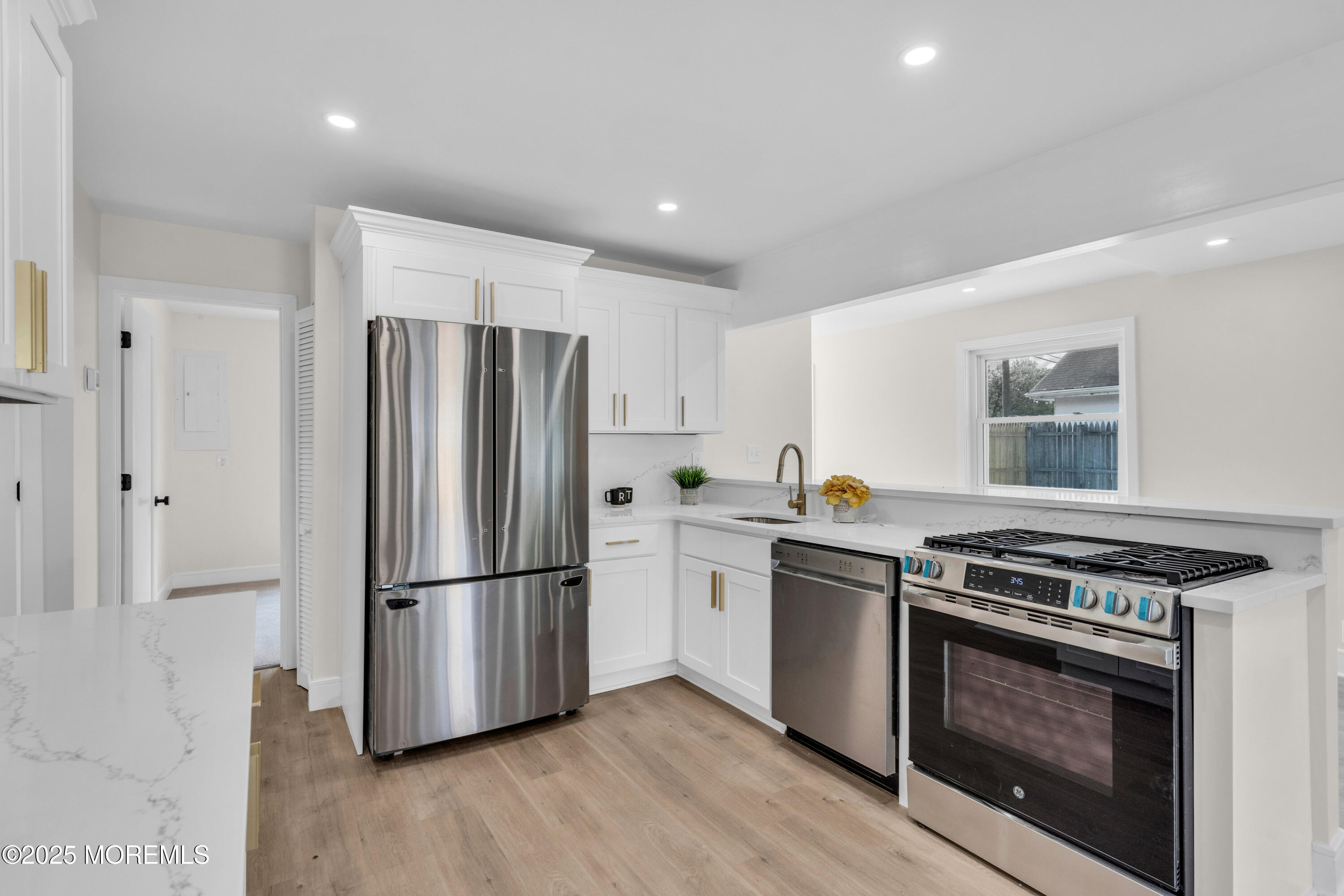 882 Radio Road Little Egg Harbor, NJ 08087 - Photo 12 of 24 a kitchen with a stove top oven and refrigerator