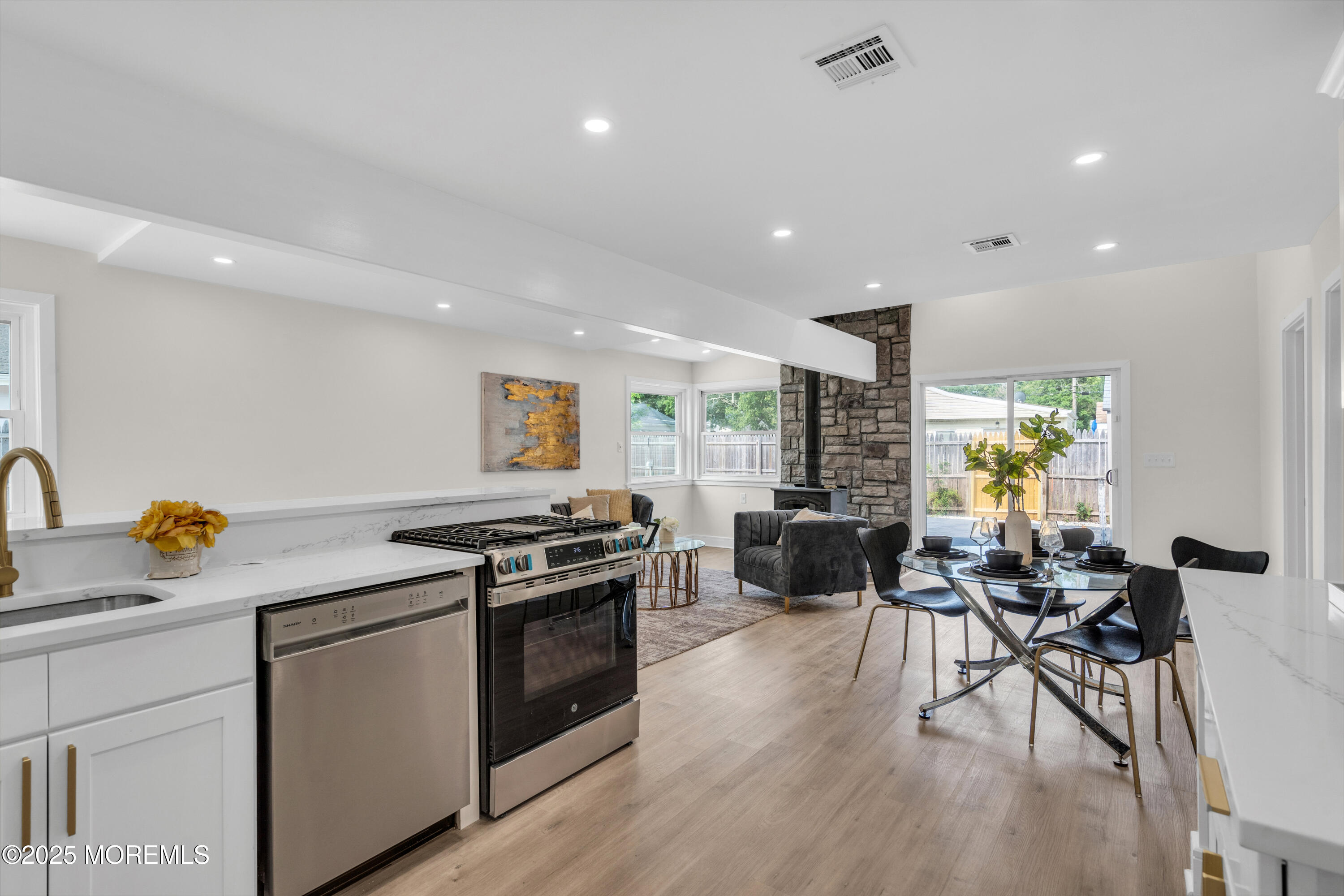 882 Radio Road Little Egg Harbor, NJ 08087 - Photo 13 of 24 a kitchen with stainless steel appliances granite countertop a stove and a wooden floors