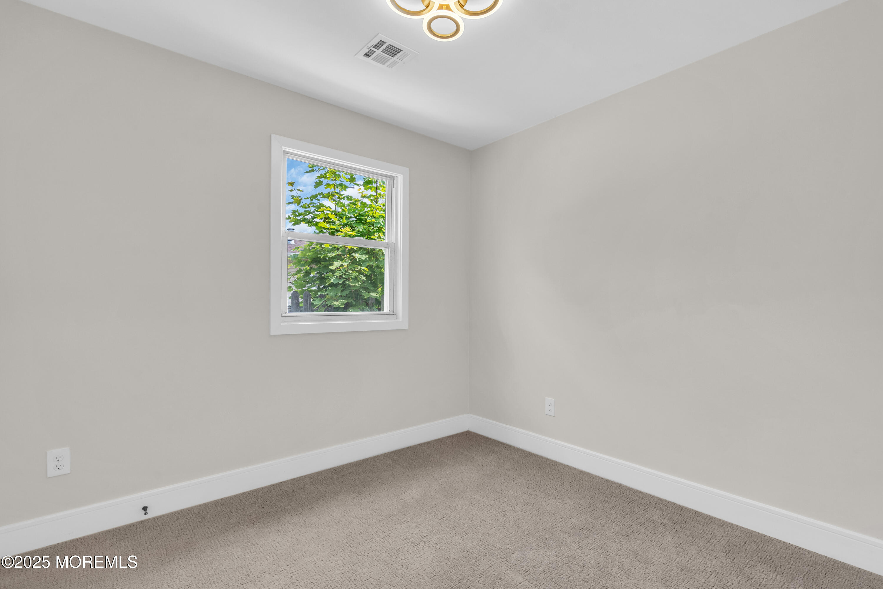 882 Radio Road Little Egg Harbor, NJ 08087 - Photo 20 of 24 an empty room with a window