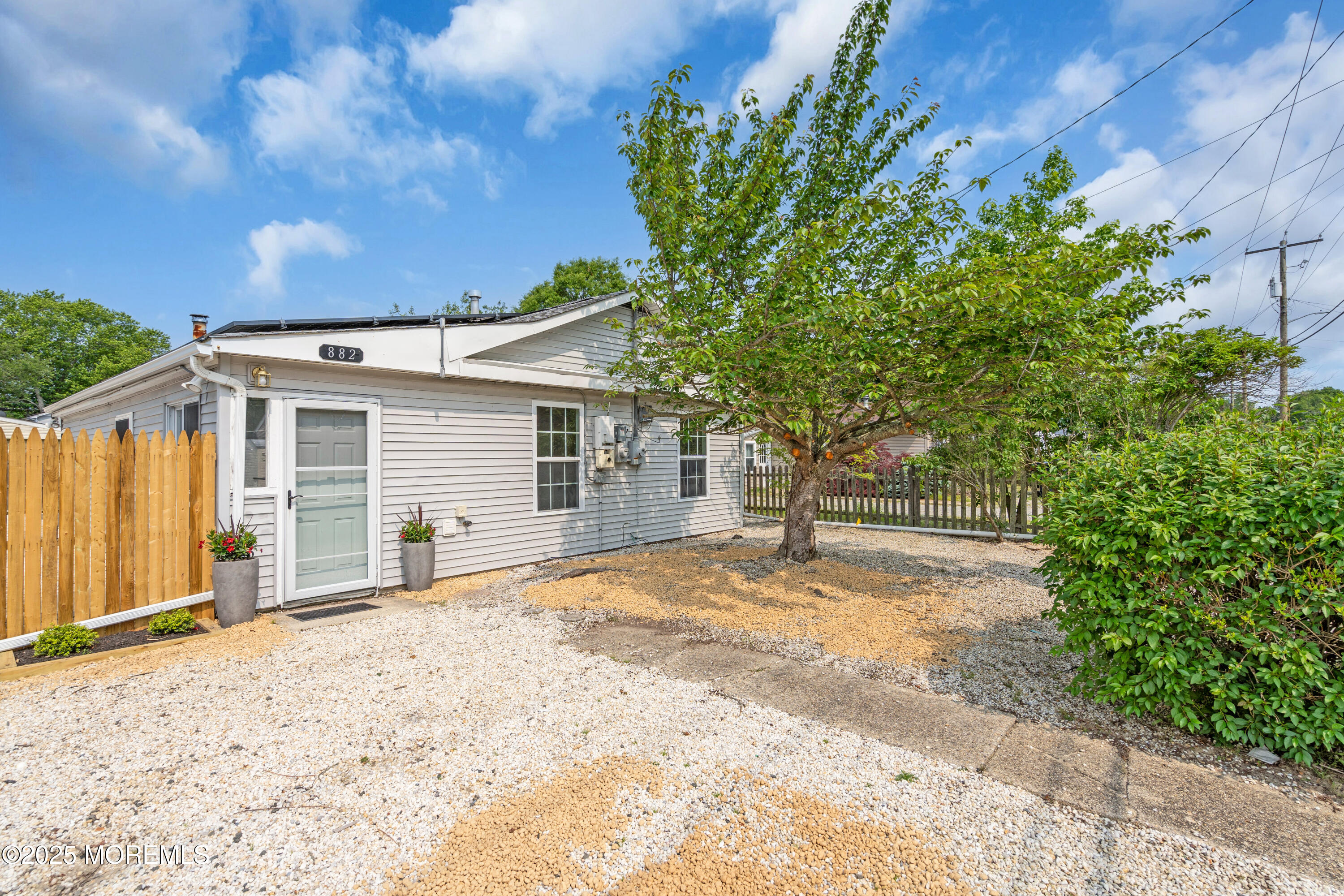 882 Radio Road Little Egg Harbor, NJ 08087 - Photo 2 of 24 a view of a house with a tree in the background