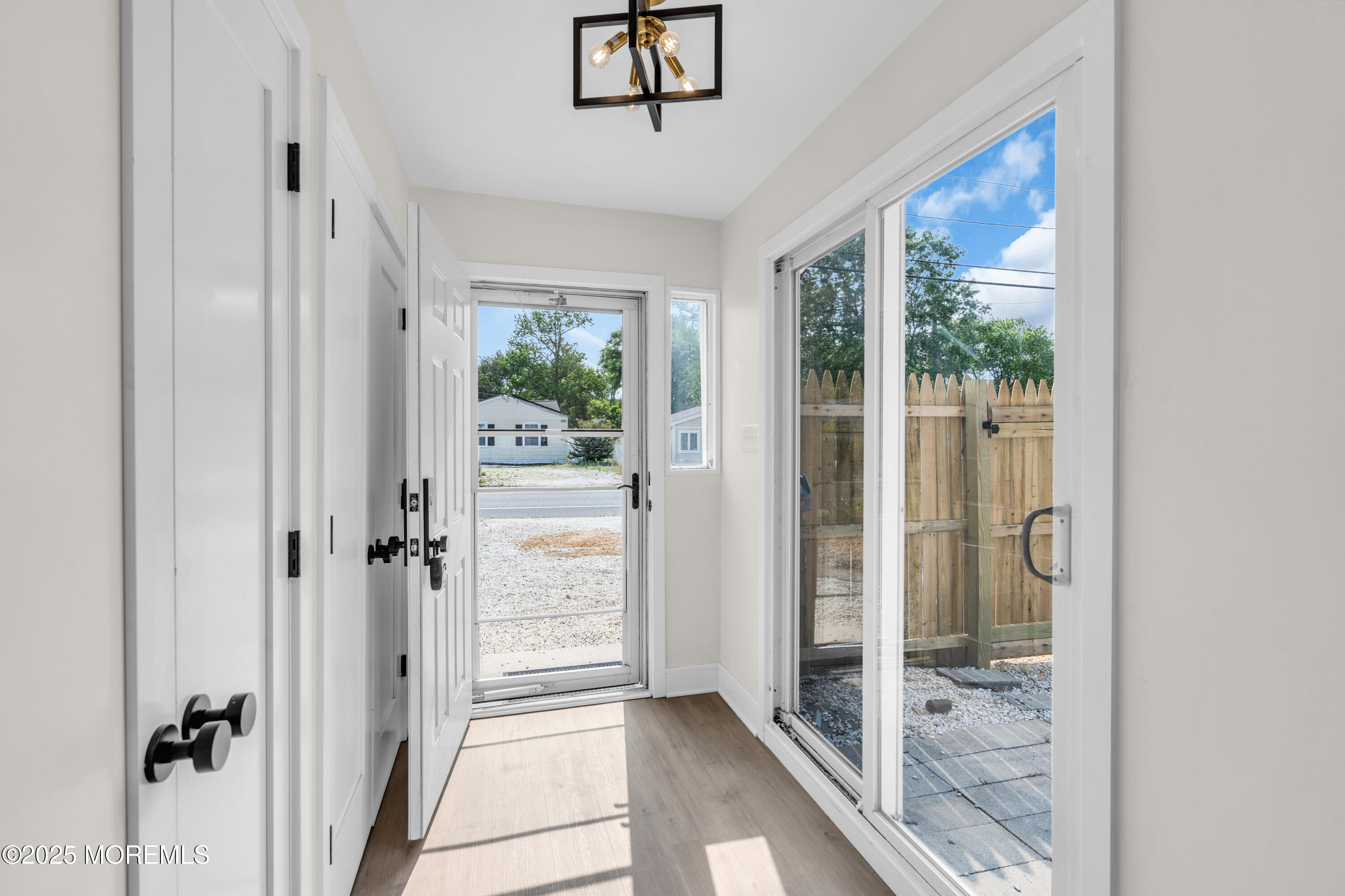 882 Radio Road Little Egg Harbor, NJ 08087 - Photo 4 of 24 a view of a hallway with a glass door