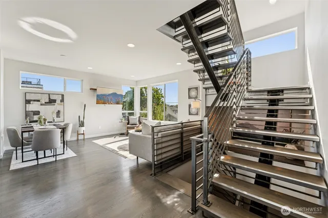 a view of entryway and hall with wooden floor