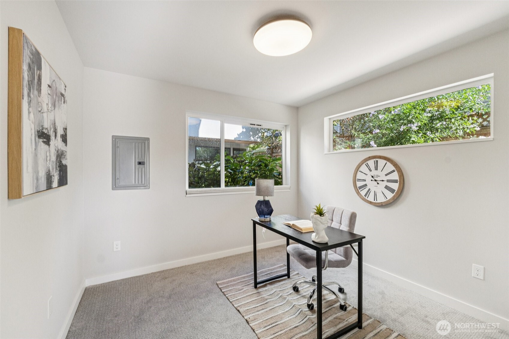 2653 Northwest 64th Street, Unit A Seattle, WA 98107 - Photo 16 of 22 a view of a workspace with furniture and a window