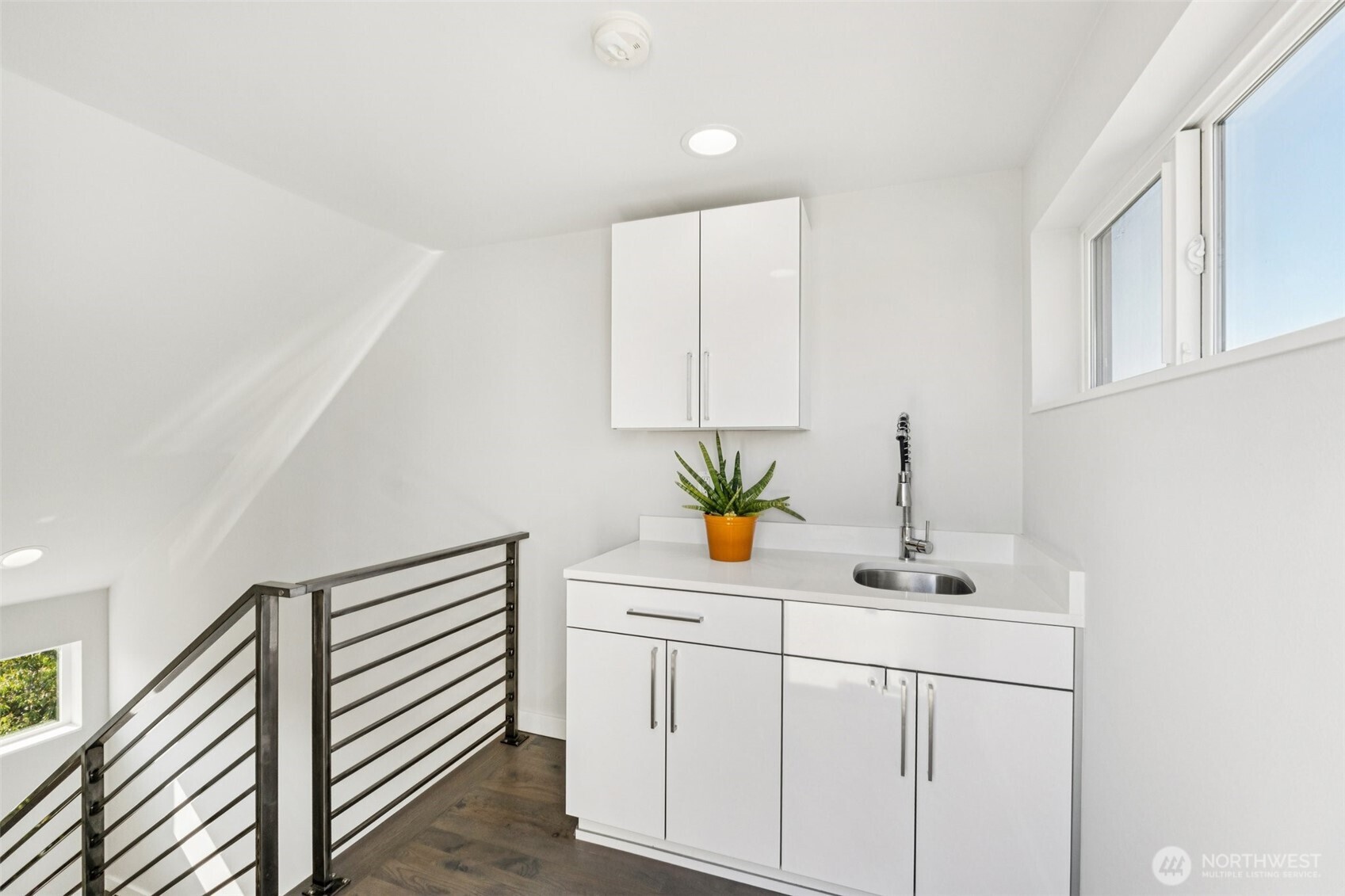 2653 Northwest 64th Street, Unit A Seattle, WA 98107 - Photo 18 of 22 a bathroom with a sink and a mirror