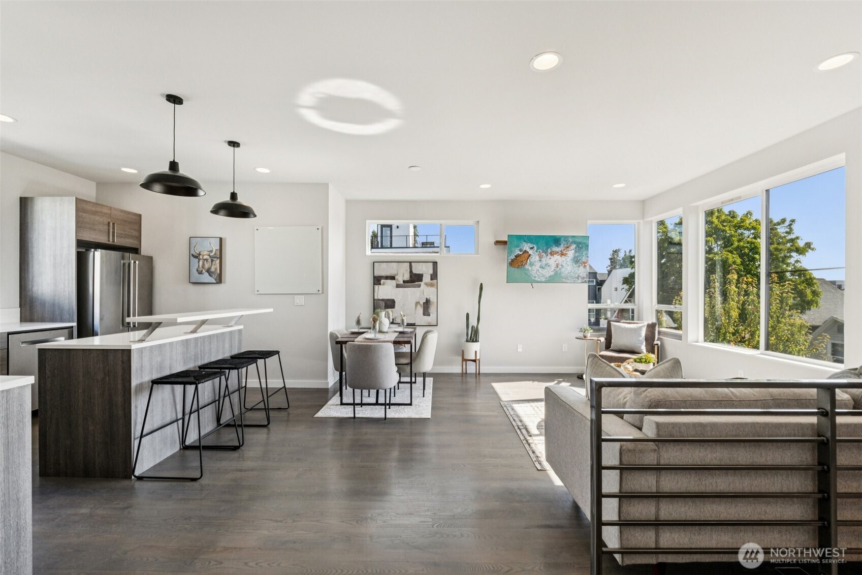 2653 Northwest 64th Street, Unit A Seattle, WA 98107 - Photo 2 of 22 a very nice looking living room with dining room and wooden floor