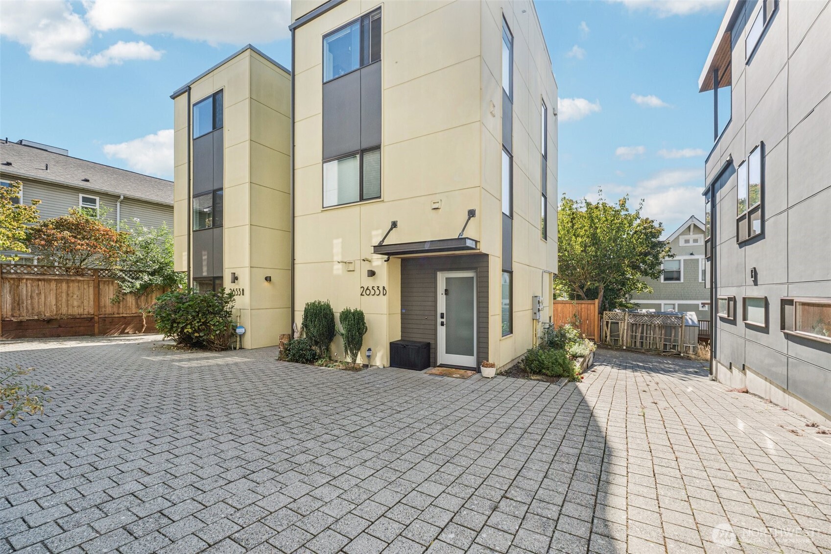 2653 Northwest 64th Street, Unit A Seattle, WA 98107 - Photo 22 of 22 a view of a building with many windows