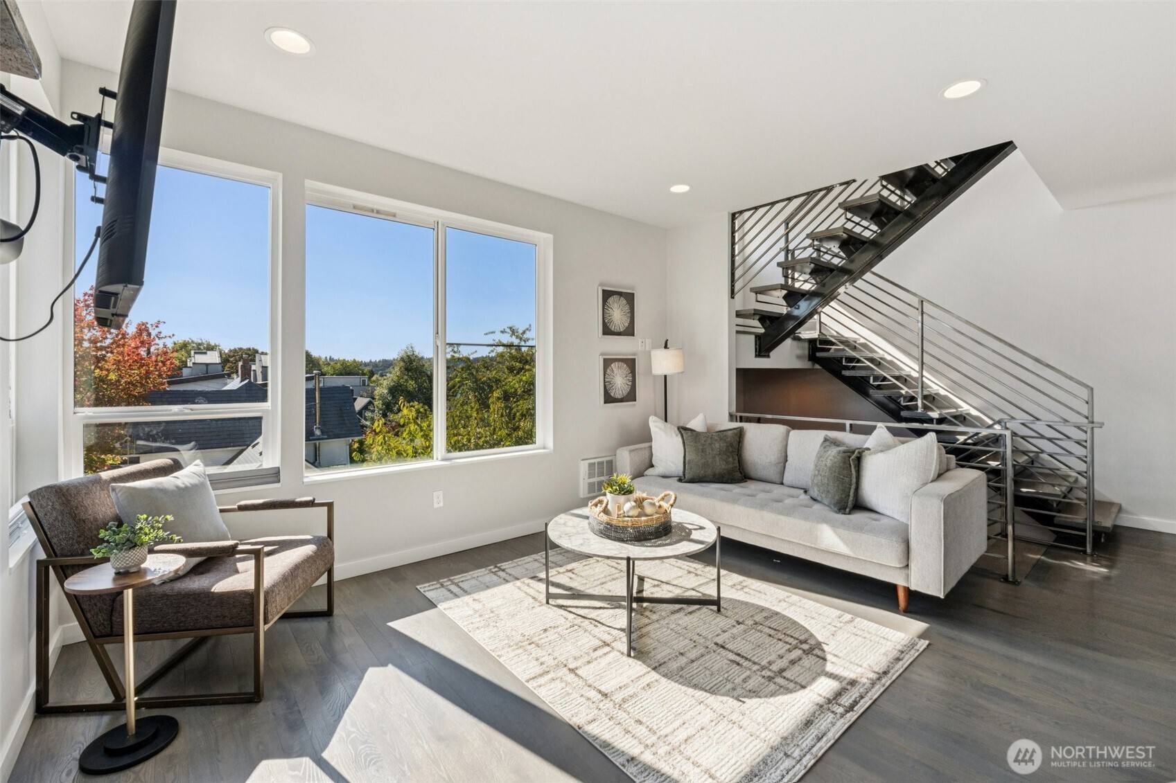 2653 Northwest 64th Street, Unit A Seattle, WA 98107 - Photo 4 of 22 a living room with furniture and a large window