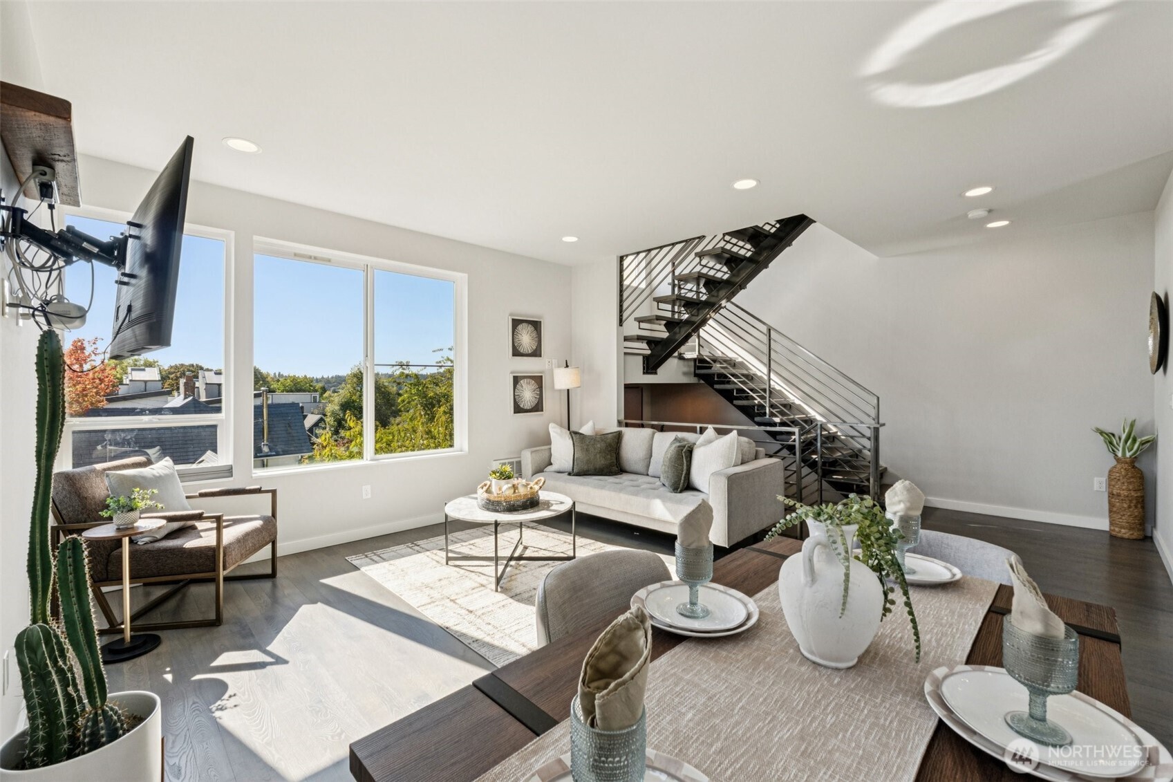 2653 Northwest 64th Street, Unit A Seattle, WA 98107 - Photo 5 of 22 a living room with furniture and a large window