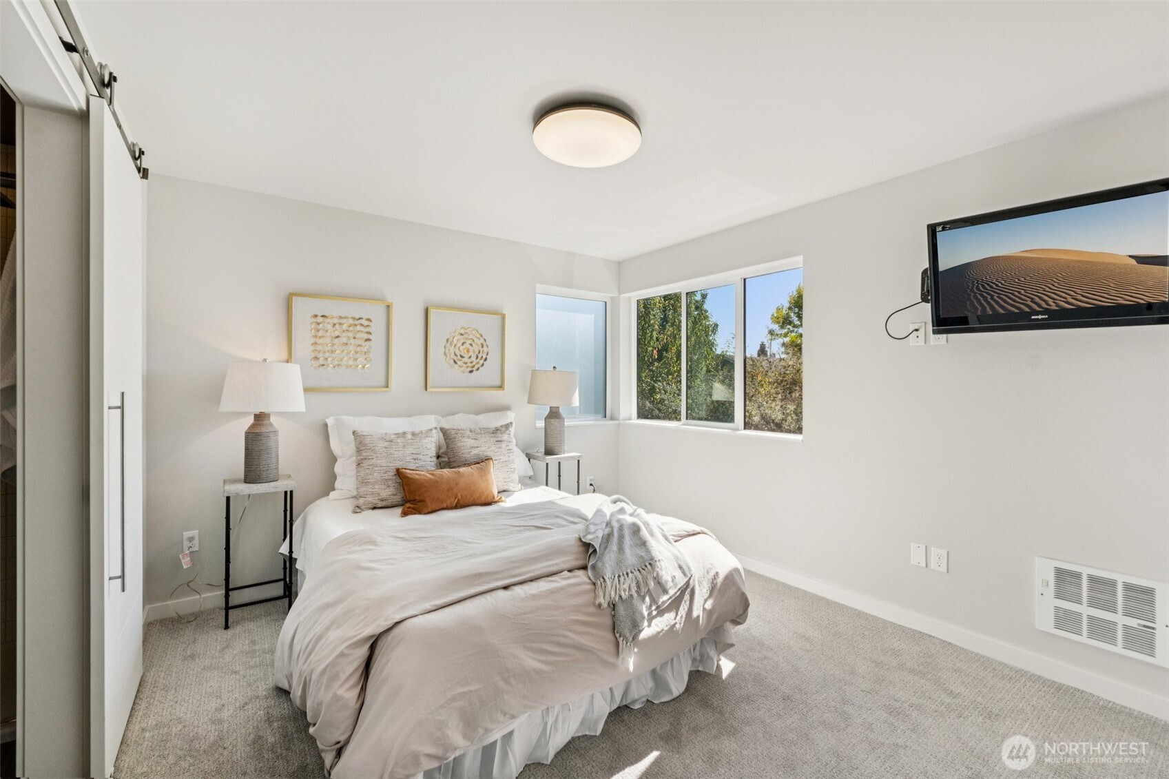 2653 Northwest 64th Street, Unit A Seattle, WA 98107 - Photo 10 of 22 a bedroom with a large bed and a window