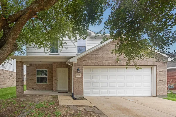a front view of a house with a garage