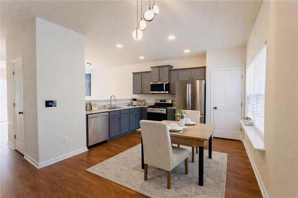 3658 Utoy Drive Southwest Atlanta, GA 30331 - Photo 11 of 28 a view of a dining room with furniture and wooden floor