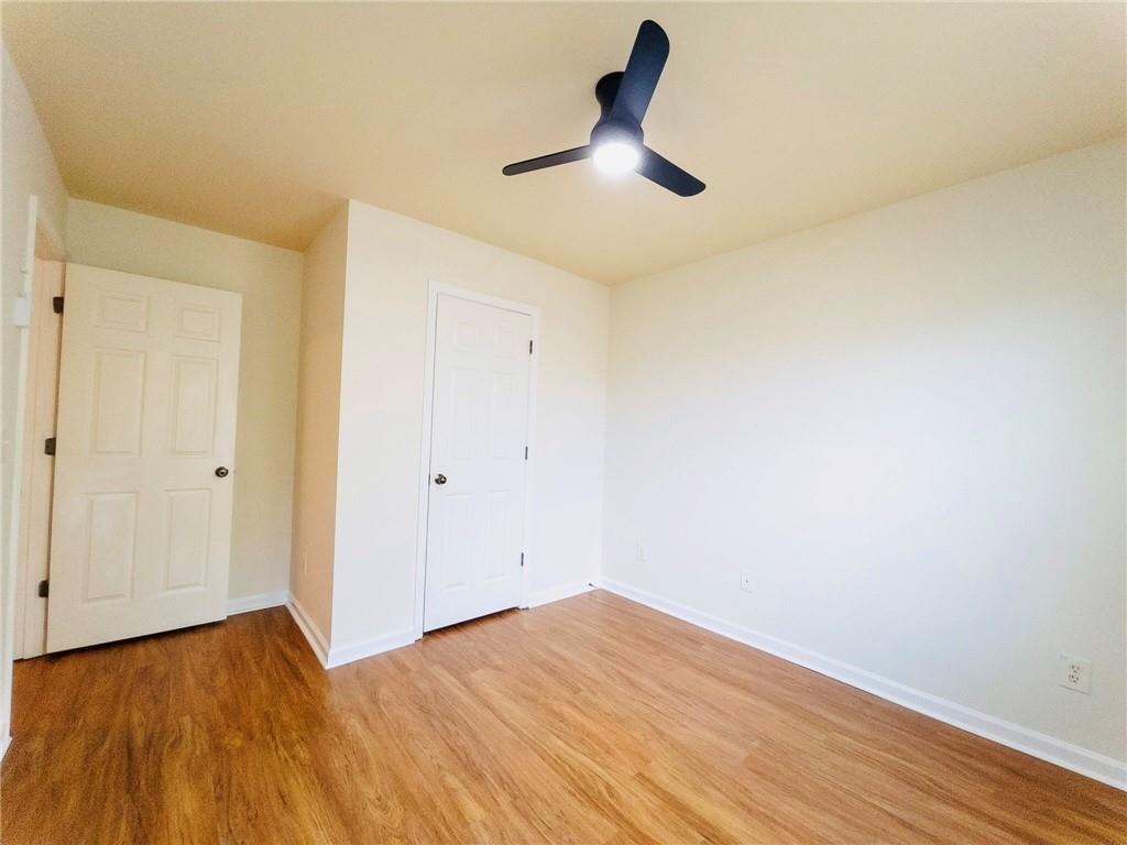3658 Utoy Drive Southwest Atlanta, GA 30331 - Photo 26 of 28 a view of empty room with wooden floor