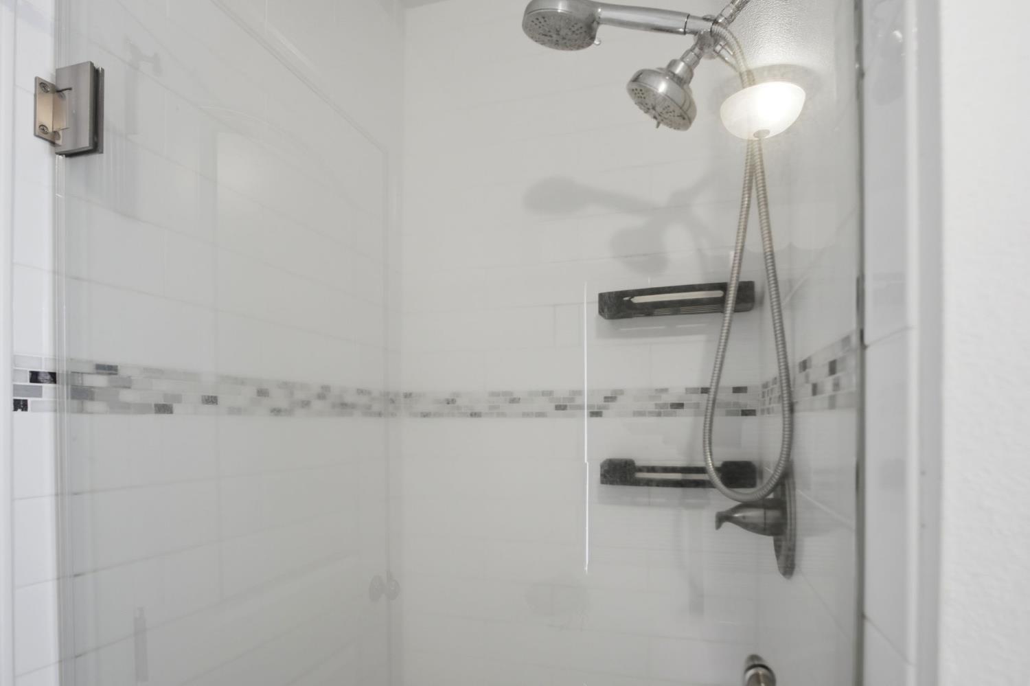 10401 Golf Link Road Turlock, CA 95380 - Photo 23 of 63 a bathroom with a shower