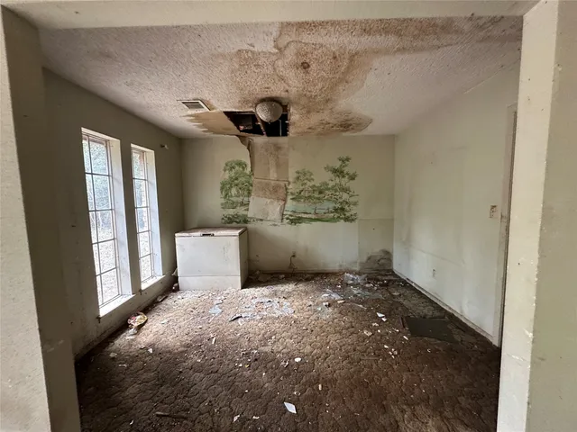 a view of an empty room and window