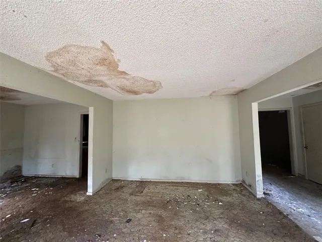 a view of a livingroom with a ceiling fan and window