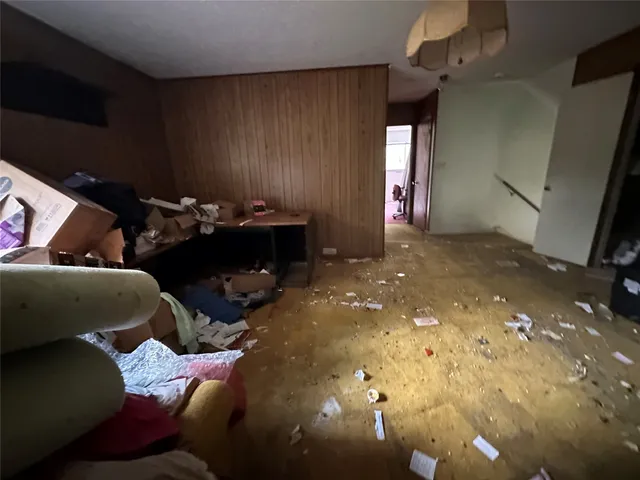 a kitchen with refrigerator and window
