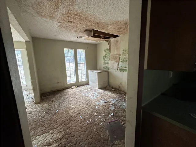 a kitchen with a stove and a refrigerator